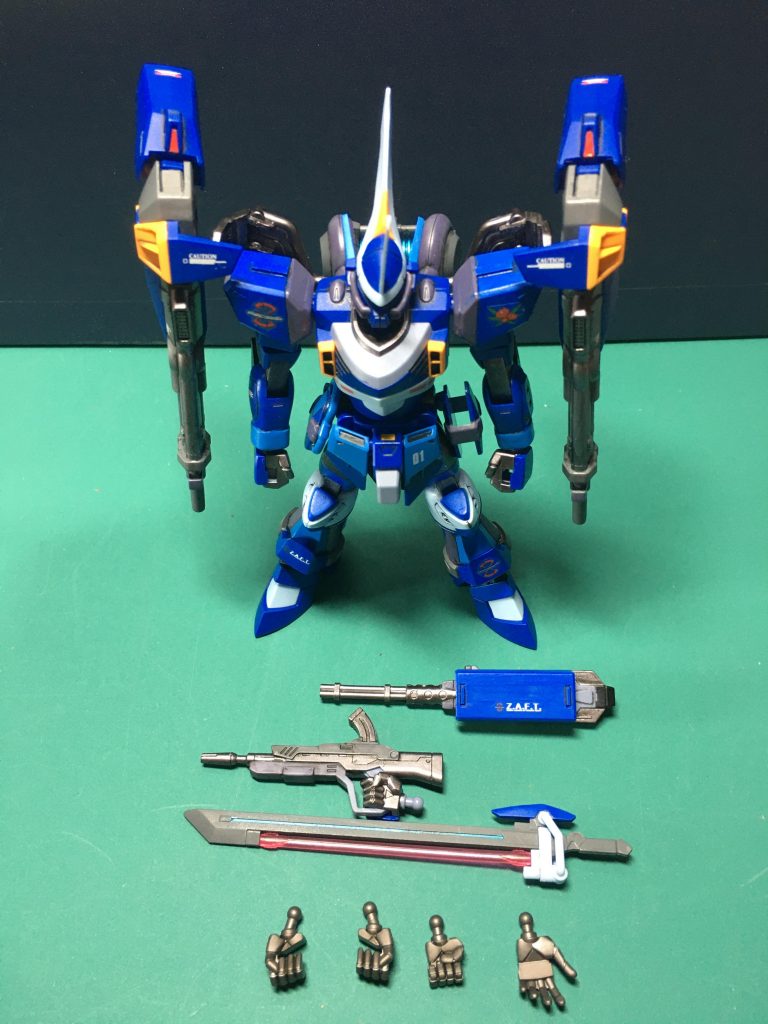 　物は少ないですがスタティックディスプレイで〆。　塗装は全てガンダムマーカーです(いつも通り？)。青＝ガンダムマーカー　ガンダムブルーメタリックブルー＝同コスモメタブルー水色＝同ライトブルーガンメタル＝同ヘビーガンメタリックグレー1＝同グレーグレー2＝同メカグレー黒＝同ブラックマーカーで本体の塗装、スミ入れ実施後にMr.水性トップコートの光沢を吹いて塗面の保護とデカール貼りの準備を行い、デカールワーク後にMr.プレミアムトップコート艶消しを吹いて完成です！　いつもガンダムマーカーの筆塗りで作ってる私の自己満足みたいな企画ですが、4/30の投稿開始から何作か投稿されているのを見かけてホッとしました。マーカーだけでも十分にカッコいい作品が作れるんだ！ということを皆さんで発信していければいいなと思います。　今回の企画で投稿された皆さんの作品は全て拝見しておきます！これから参加される方々、ご投稿をお待ちしてます！