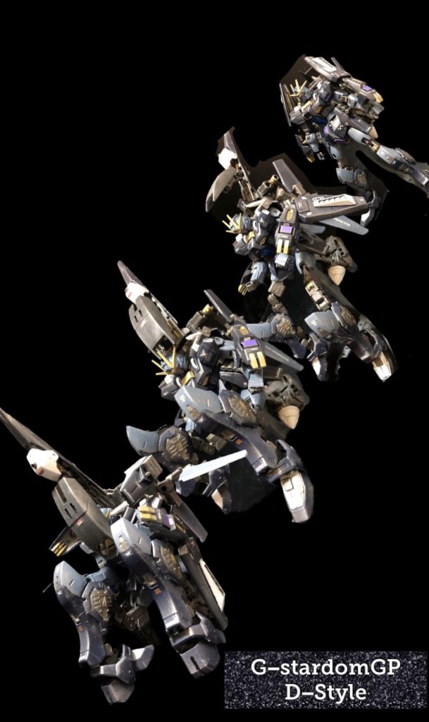 oyz「完成!!”G−スターダムGP D形態“っ!」くろいの 「コレは!?サイコガンダムのフォートレスモード!?」oyz「そうです!この形態になる事で、防衛重視のスタイルになり、GNフィールドが使用出来る様になります。GNフィールドはビーム兵器、実弾兵器を弾きますので、拠点防衛に非常に有効です〜。敵が拠点に攻めて来たら、拠点ごとGNフィールドに包み込んでしまえるんです。」くろいの「おお、鉄壁の守りと言う事か!」oyz「ただし、GNフィールドの連続使用可能時間は2分です〜。」くろいの「2分かあー!」oyz「まー擬似GNドライブですからね〜。しかし、まあ充分ですよ。GUNSTARDOMのフォースメンバーは優秀ですからね。2分も持ち堪えたら、なんとかしてくれますよ。ねえ、リーダー?」くろいの「まあ、そーだな!しかし、A−装備だけで、攻撃も防御もこなすとはね。」oyz「ただ、それだけ運用が難しくて、攻撃を重視すると拠点防衛に間に合わなくなったりする可能性もありますよね〜。ですので、攻撃を重視するか、防衛に徹するかは、くろいのフォースリーダーの采配次第っていうか〜。」くろいの 「あーやっぱり私の采配ね〜。って!ええい!プレッシャーをかけるのをやめい!Σ(゚Д゚)」