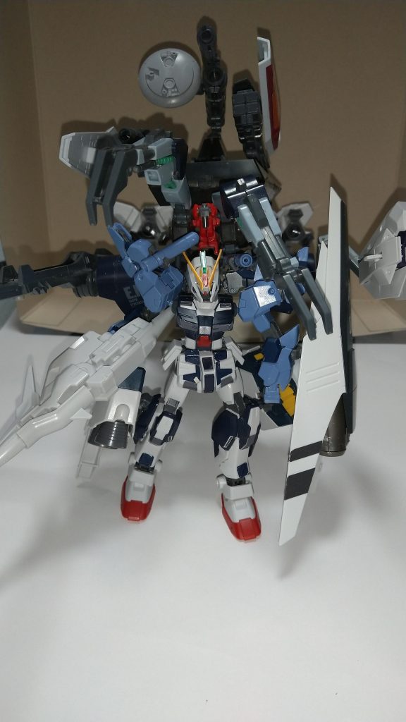  ガンダム・リベラティオ(拠点攻略仕様)上記の大型アームユニットに拠点攻略ユニット[リーベタス]を装備した形態。脚部に熱核パルスジェット機を搭載しリーベタス本体後方にプロペラントブースターユニットを4つ搭載、これにより機動性が爆発的に向上した。武装面では上記の大型アームユニットの武装に加えリーベタスユニットに大型ビームキャノン砲、ディスクレドームが搭載している。これにより超遠距離からの大出力ビーム砲を発射可能。その他には四連装ミサイルランチャー、ツインビーム砲、大型メガ粒子砲2門、5連装中型ミサイルポッド6つと言った豊富な武装。武装やブースターはデッドウェイト化を防ぐ為パージが可能。なおリーベタスユニットは単体でも動かす事が可能な為超遠距離に配置し攻撃する事も可能。ちなみにリーベタスはラテン語で自由を意味する。 