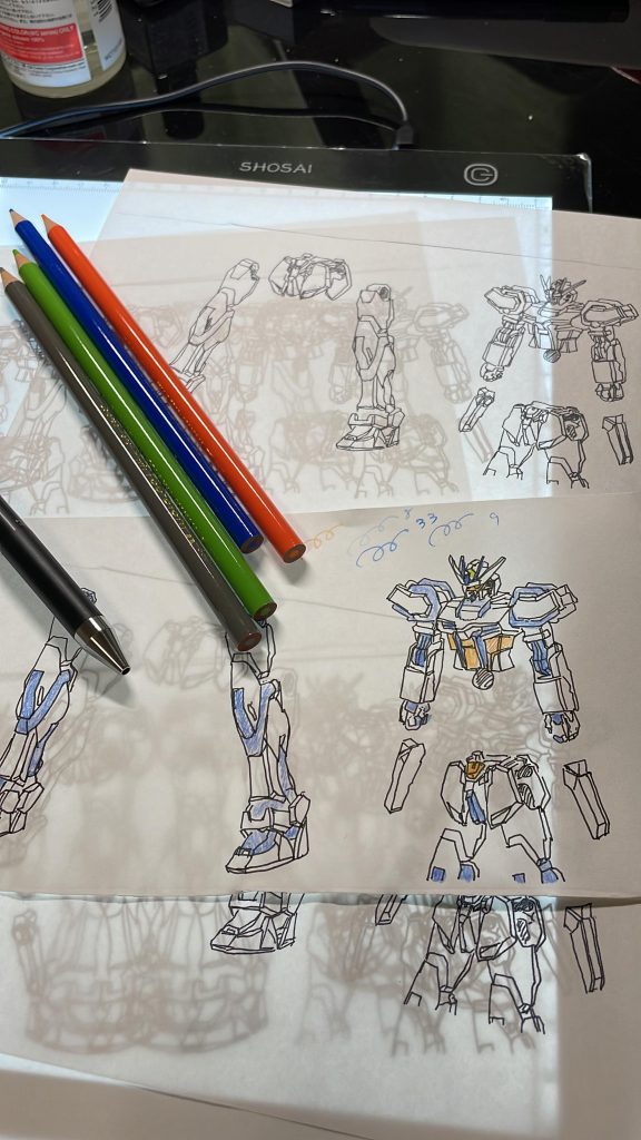 まずは配色は、元のEGのストライクの説明書の一部をトレース、白黒で線画をコピーしてからひたすらしっくりくる色合いを決めました。塗装は2回目、初めて規定の色以外の色で塗るので不安もありましたね...