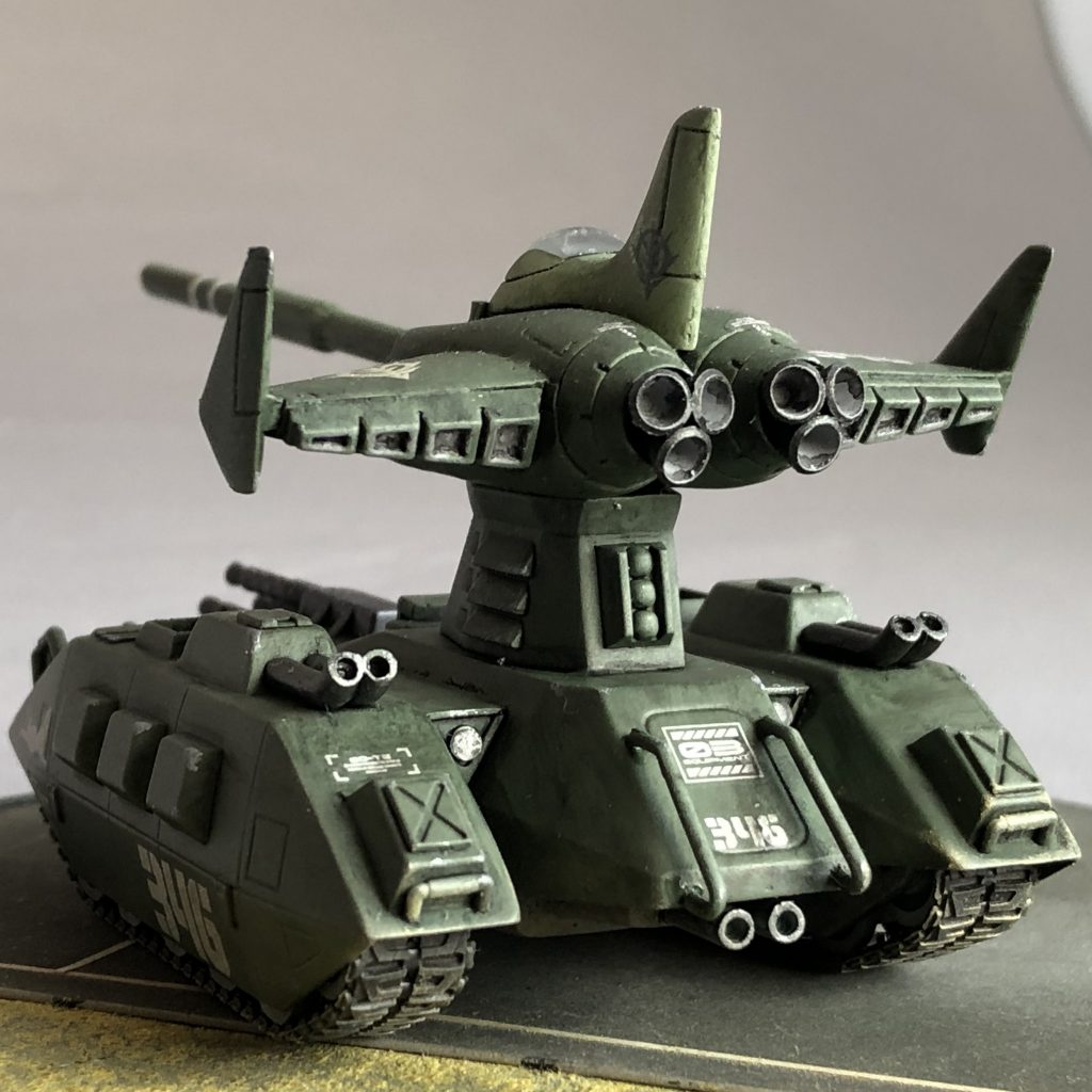 マゼラトップ部背面ショット・オリジナルは片側4発、計8発のノズルですが、ちょっとしつこいと思い、市販パーツにて片側3発、計6発に変更。 ・マゼラベース下部マフラーもピンバイスで開口。