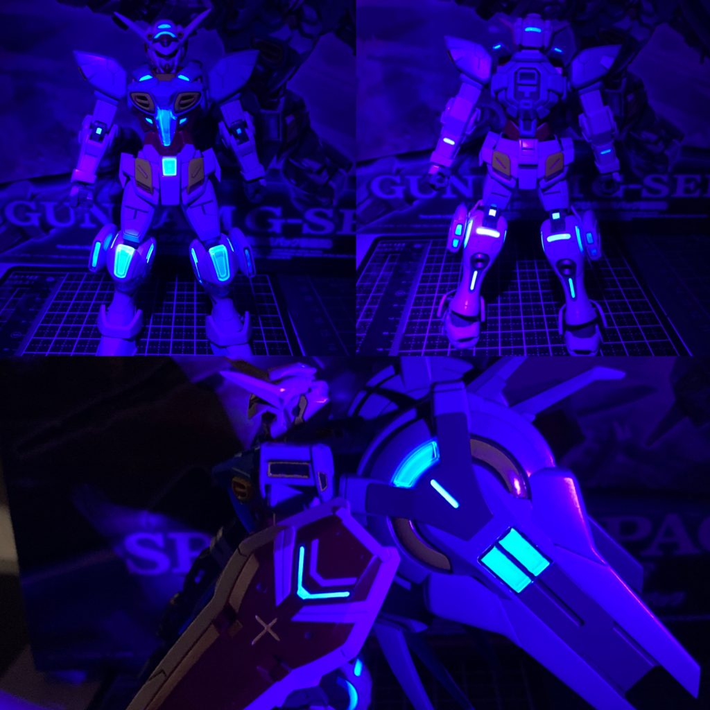 クリアパーツがブラックライトに反応して光る事実を知り、それに合わせて機体各所の水色部も蛍光塗料で塗るのがGセルフ制作のトレンドという事実を知る。慌てて蛍光カラー探しに出るも、蛍光カラーの青はガイアカラーにしか無い事を知り、なおかつ田舎町代表の福井県ではガイアノーツの取扱もごく限られた店舗しか無かった…そしてどの店舗も何故か青だけ売り切れ。最終的に、お隣石川県は金沢市の「みなと模型」さんで手に入りました。カシーバミコシで福井にもっと運んで下さい！