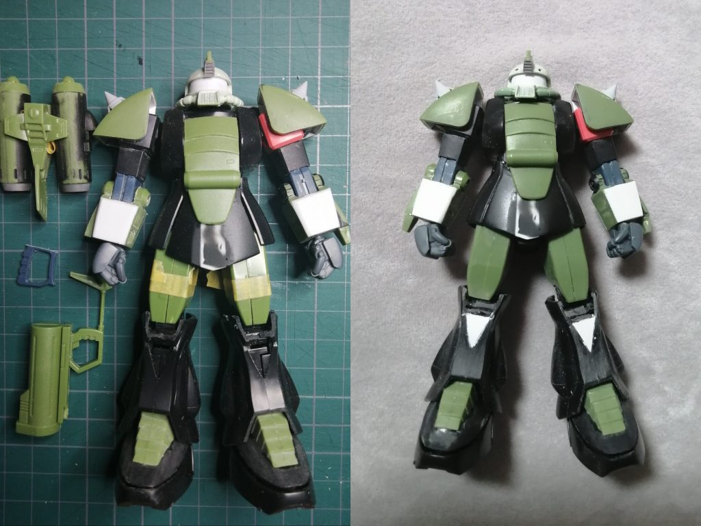 製作途中だとパーツごとに色が違うので流用具合がわかりやすいですモノアイ部分は水中を見るためが通常よりも広がっているため久部分を削り込んで正面から見た時に黒い部分が広く見えるようにしていますくちばし?の部分は本来イラストでも設定でも幅が一定なのでザクⅡを改造すればいいのですが、旧キットの広がっているくちばしが勢い?があってイメージでカッコよかったので移植しています上腕部はそのままだと細すぎてバランス的にも、ザクⅡの部品を流用しているように思えないので通常腕部+ビーム?機構分で幅を増しています本来甲の部分のスリットが足首周り一周あるのですが、スカートでほぼ見えなくなってしまう割に、あまりにも手間がかかりそうなので根性が足りず諦めました胸のロケットポッドは片側だけでネオがネオジム磁石でつけ外し可能です 塗装を厚めにして剥げないようにしたはずだったんですが、つけ外しの振動?みたいなものでだんだんと塗料に変な跡かついてしまいましたサブロックガンのストックは真鍮線に交換しています