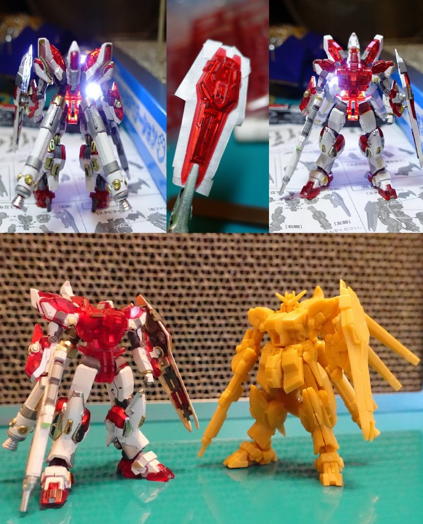 【ウラバナシ】チマタはRG　Hi-v祭りを呈していますが、敢えてそれにあらがって今更のアーティファクトで（RGを手に入れられないヒガミです（笑））1stのボックスには3体のハイニューが。そのうち1体はレアカラーのレッドクリア。結構濃い赤のクリアなので、マスキング塗り分けで赤として活用することに。ふんどしがないとアストレイのレッドフレームのよう。シールドを裏からガンマカ・シャインシルバーで吹くことで、すごくメカメカしく。一応クリアレッドだった記録として光を透かした写真を撮っておきました。パネルラインにアクリジョンの蛍光ピンクで墨入れしたのですが、アクリルうすめ液を綿棒に付けてはみ出しを拭き取ったら、ガンダムマーカーまで剥げて、焦りました。