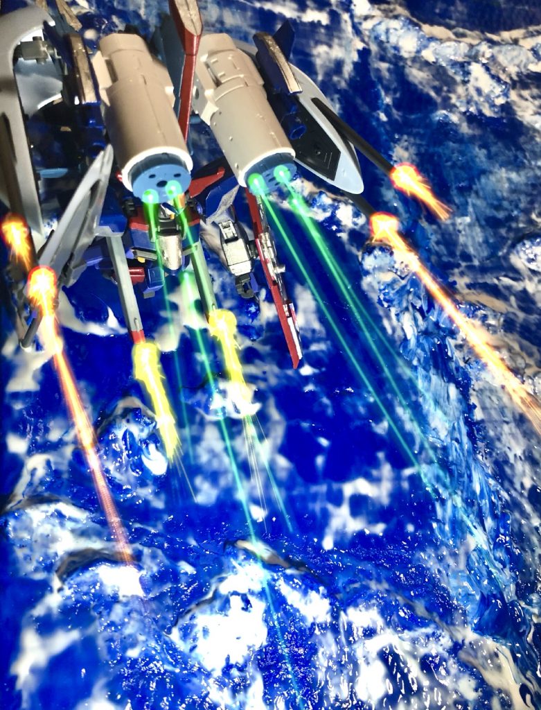 武装面は先代のアビスと違いカリドゥス改複相ビーム砲の様な単一兵装での火力よりも、既にザフト系MSに普及している実体弾やフォノンメーザー砲を組み合わせ豊富な手数による面制圧と武装に消費するエネルギーを抑え長時間に渡る継戦能力を重視している。