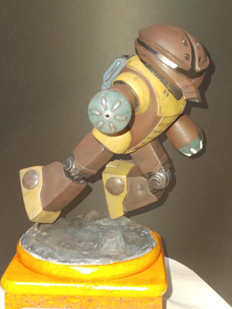 これから建築業(ガンプラ趣味)を目指そうという新卒者の皆さん。我がロートル建設株抜き会社は皆さんの心意気を買います。明るいガンスタが皆さんの前に在らんことを願いまして 今回の会社説明会を終わらせていただきます。ありがとうございました。え～、それでですね。このあとしばらく ここで個人ガイダンスを承りますので、是非にと思われた方はご遠慮なくどうぞ。その際は、こちらの受付担当者に入場カード提示でお願いします。「受付担当のアカハナです。では、最初の方からこちらへどうぞ。」