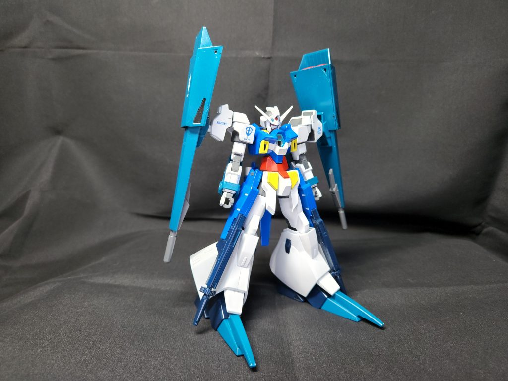 全体はこんな感じこれまで作ってきたオリジナルウェア同様頭、胴体には基本的に手を加えず極力四肢のみの改造に抑えましたまた、足は他のAGE-2同様に太ももは通常のものを使用して膝以降を改造しました手首周りのパーツも他のAGE-2ウェア同様パーソナルカラーにしています