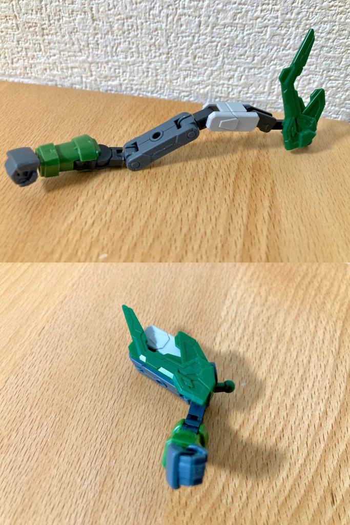 腕部ドラゴンハングの伸縮機能は、ガンプラバトルアームやボールデンアームアームズ等のパーツを組み合わせて独自に再現しています。肩の形状を改修して格納ギミックを実装し、腕を伸ばした状態でも収納した状態でもバランス良く整うよう、かつアクションポーズの実用性に耐えるよう工夫して造型しました。