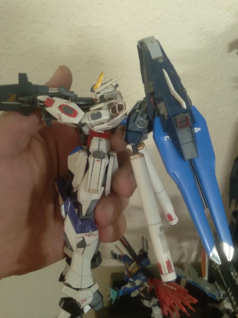 The tanks are from the hg sinanju and fit perfectly where the 2 dragoons would go. I also used some astrea type f beam saber handles on the arms for quick use