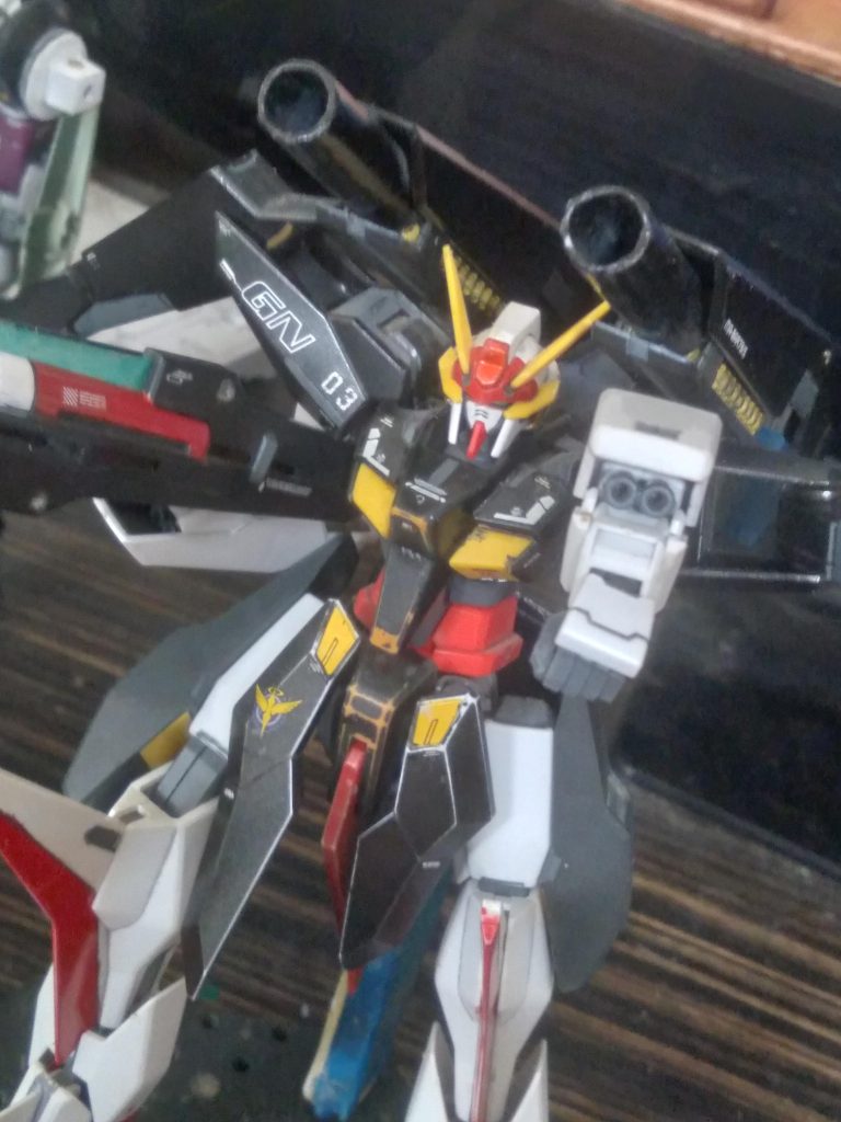 GN-R3 Gundam Cygnus. The transformable mobile suit of the team, Cygnus has no equal in terms of maneuverability in both the atmosphere and in space. It's offensive weaponry consists of 2 back mounted gn cannons, arm mounted gn vulcans, and a handheld gn beam cannon.