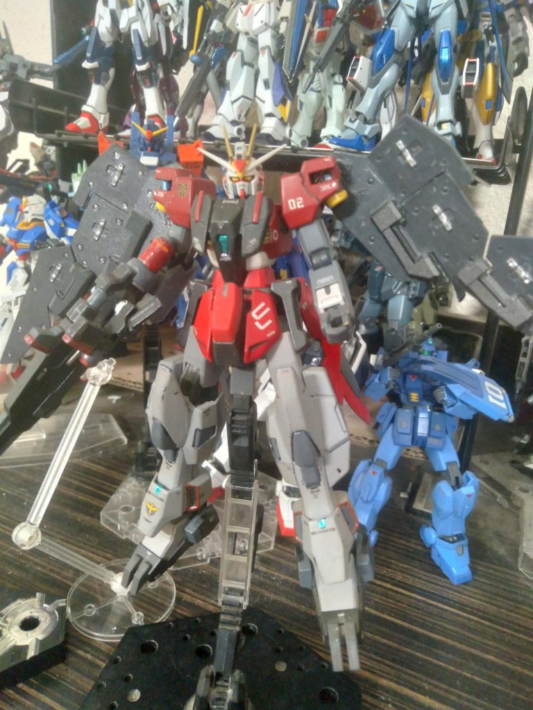 GN-R2 Gundam Antares. Created to be the big gun of the team, Antares specializes in barrage and suppression fire. gun, gn pistols, and gn shield bits. The gn full shield can be equipped for defense. Mobility improvement comes in the form of the GN booster unit