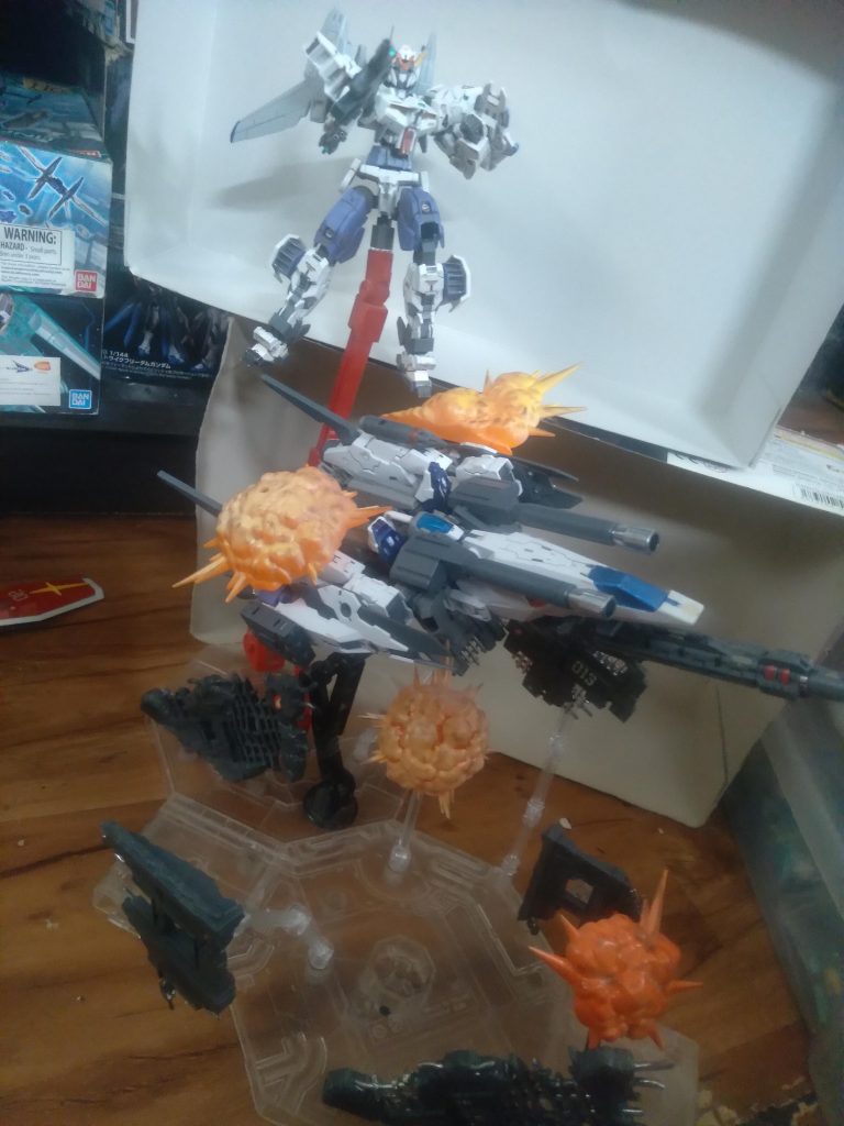 Made by using my Alto C-Type and custom Ares variable machine. I also added some gundam base exclusive space debris. Finally, some bandai explosion effects that I painted.