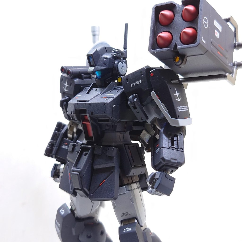 ジムスパルタン一年戦争時北米で運用され、戦後も新設部隊ヘルドッグスで運用されているジムスパルタンの一機。大型ミサイルポッドど索敵レドームを追加したことで中距離火力を高めている。