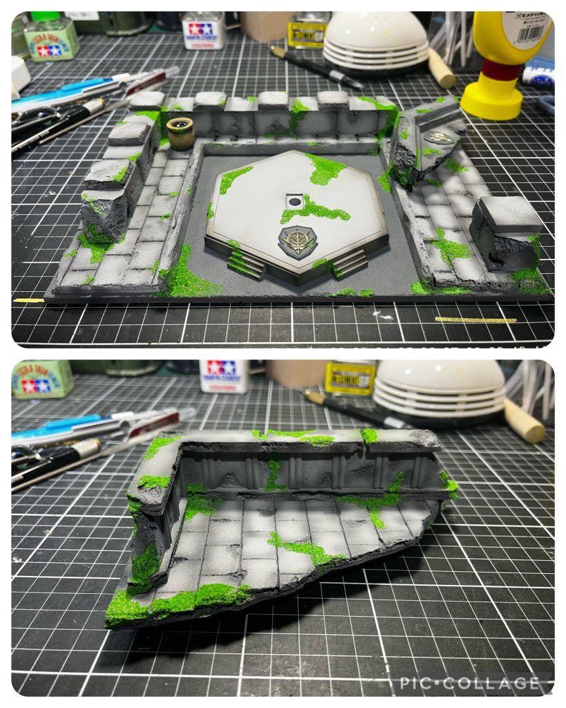 ジオラマ制作②断面や石畳の切れ目などにタミヤの緑の方の接着剤をつけて少し溶かしてます。サフを吹く時にも気持ち溶剤を多く入れて表面が全体的にちょっとだけ溶けるといいなあとやってみましたが、なかなかいい具合になりました。こちらも濃いめの灰サフでグラデーションというか、汚れてる感じを出しました。ボンド水を作り、筆で塗ったところにシーナリーパウダーをパラパラと。左奥の壺はエポパテが余ったので作ってみました。