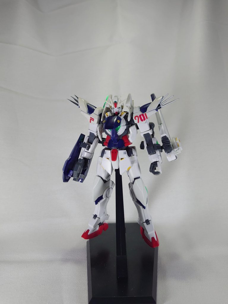 サナリィは偶然特殊な光子「GN粒子」を発見。それを利用した新しい動力機関「GNドライヴ」を開発。この動力機関はフォーミュラ計画の『901番目』の機体に搭載されることとなり、本機が誕生した。