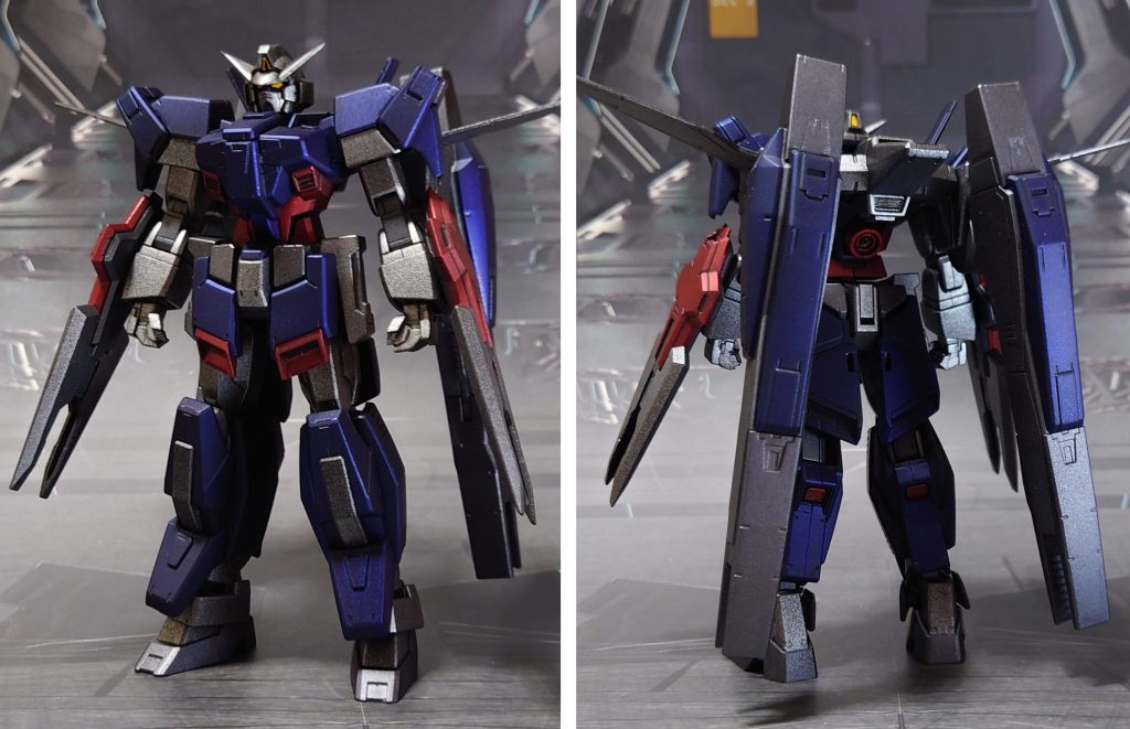 ガンダムAGE-1フルグランサの前後ろ。塗装以外の工作としては、パーティングライン・ヒケ・段ズレの対処、足裏の肉抜き穴埋め、頭部アンテナ尖らせ、市販パーツでディティールアップ。更に、AGE系の他キットから左右握り手、右平手を追加しました。■塗装レシピ銀:黒サフ→シャインシルバー→つや消し青:黒サフ→シャインシルバー→ディープメタリックブルー→つや消し赤:黒サフ→メタリックレッド→つや消し追加装甲フロントアーマー赤:黒サフ→ブライトガンメタル→(マスキング)→メタリックレッド→つや消し薄グレー:黒サフ→ブライトガンメタル→つや消し濃グレー:黒サフ→ガンメタル→つや消しビームサーベル刃:根本にベースホワイト→先端にメタリックレッド→蛍光ピンクその他部分塗装、墨入れ:ガンダムマーカー各種→つや消しセンサー類:トップコート後に付属シールを貼り付け