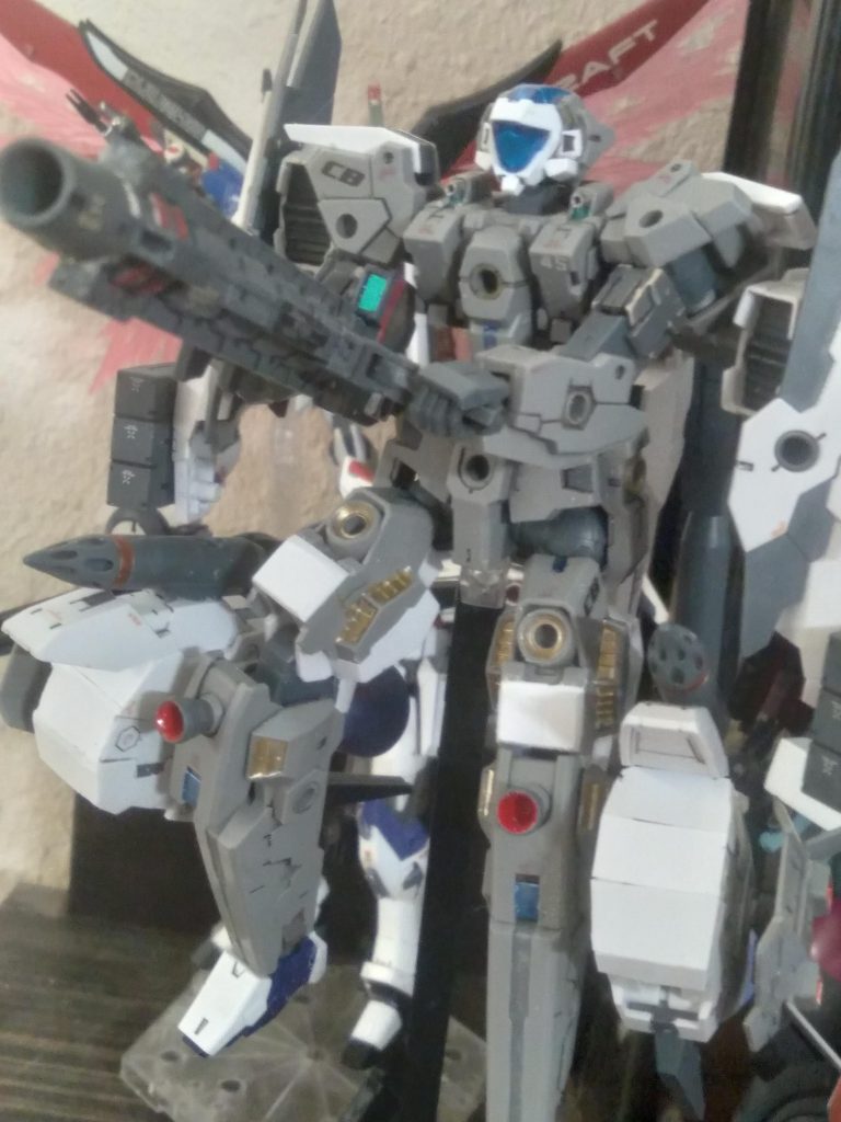 Preparing to fire the mega beam launcher. I also used plastic board to cover the hollow parts on the boosters. I may have to go over them again though. The feet are from the air fighter. I removed the back wheel and used pla plate to shape the heel section