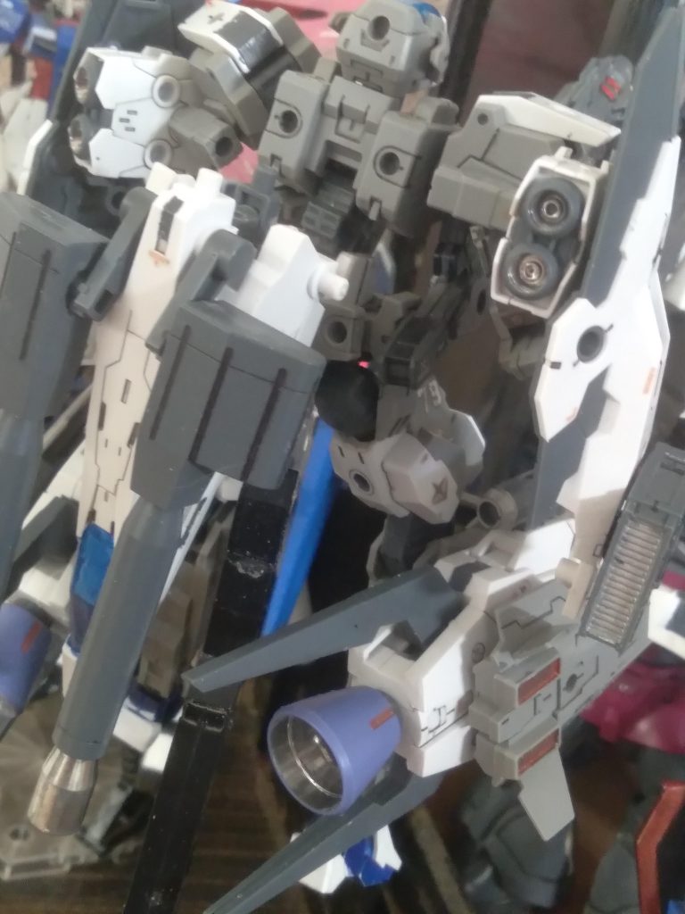 The nose section rotates to the back skirt. The binders rotate downward and the missile pods rotate to the front. The thrusters are from the space craft