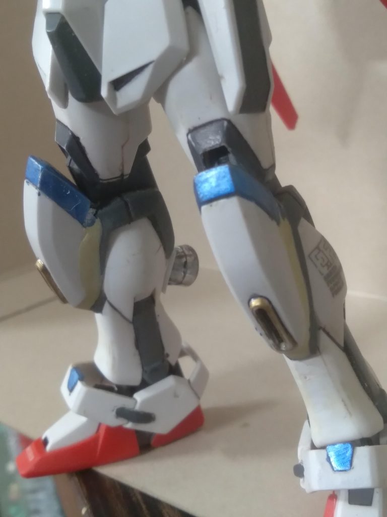 The hgce freedom knees were transplanted to the strike frame with putty. The build strike ankle armor was also used. Thrusters were added to the legs for improved mobility