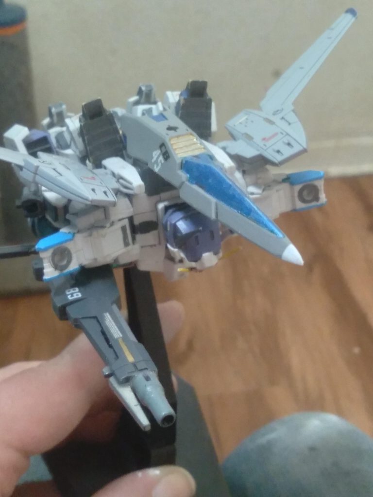 I used some of the air fighter parts on the backpack. This allowed me to drill holes in the bottoms of the feet and they peg into the backpack securely.