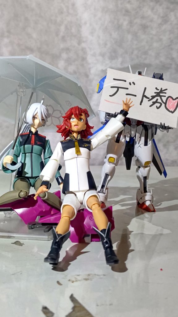 無邪気に応援する花婿が楽しそうでご満悦な花嫁の図。ミオリネはこんな座り方しないだろうけど御容赦下さい(苦笑)まぁ、こんな感じでデートを賭けて闘う漢(バカ)2人の行く末や如何に!?……学生の決闘の理由なんて、こんなんで良かったんだよ……(涙)