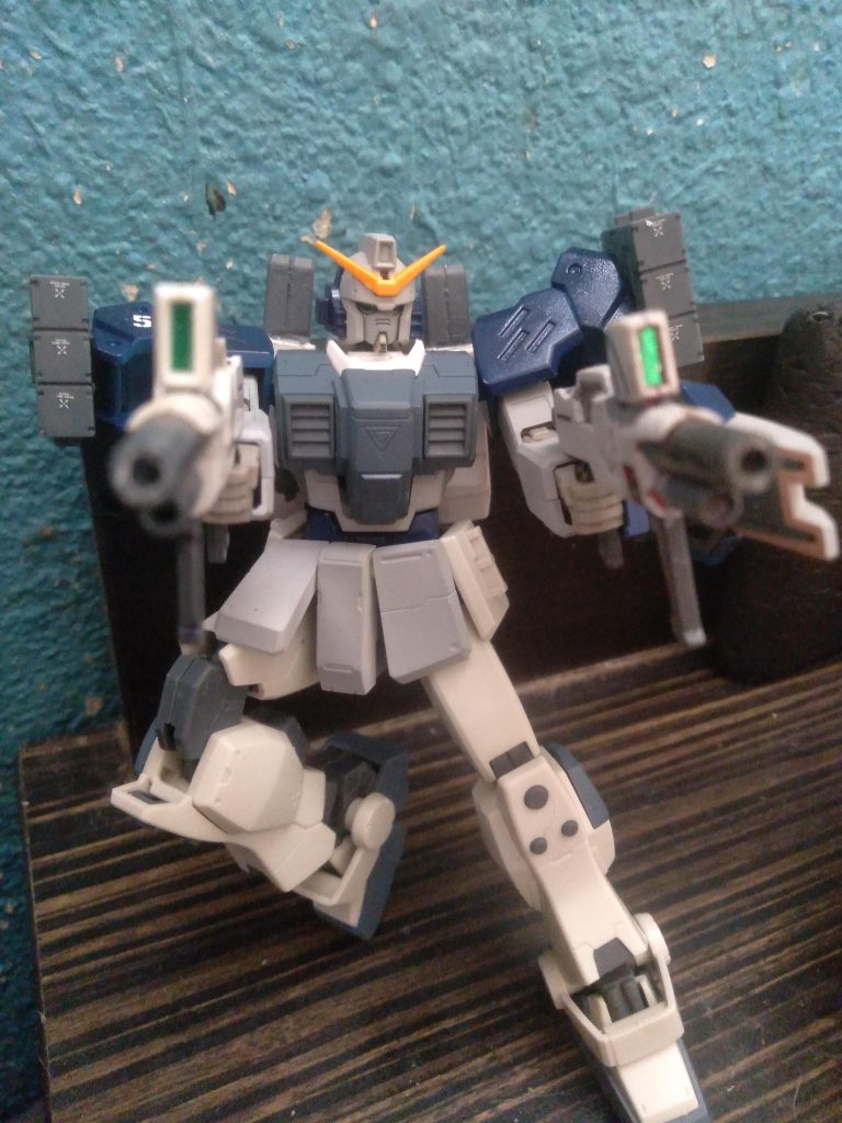 Standard armaments are shield, 2 beam saber handles stored in the lower legs, and 2 shortened beam rifles. They back has been modified to make quick backpack changes during battles