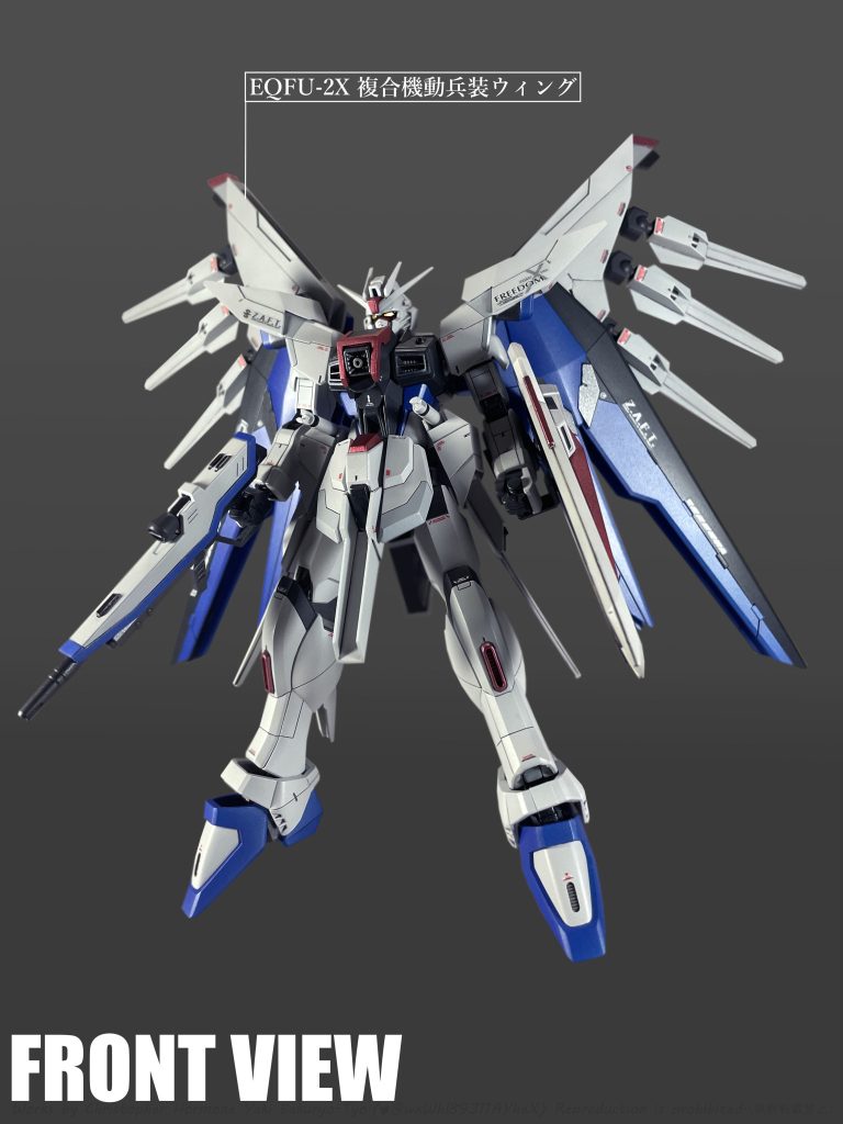 新規搭載の「EQFU-2X 機動兵装ウィング」はドラグーン端末とレール砲を格納する可変式複合兵装。開発段階では惑星間航行用推進システムを利用した推進器の搭載が検討されていた。また、能動性空力弾性翼の一種でもあり、姿勢制御能力がより向上している。「機動兵装ウィング」の搭載に伴い「M100 バラエーナプラズマ収束ビーム砲」はオミットされている。