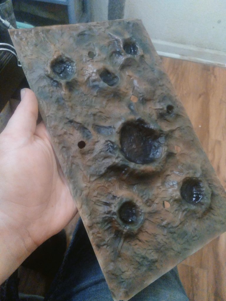 Tamiya brown, dark green, and black were used on the surface. I also tried out some shading around the craters to give them more depth. I think I did a good job. I am proud of this accomplishment 