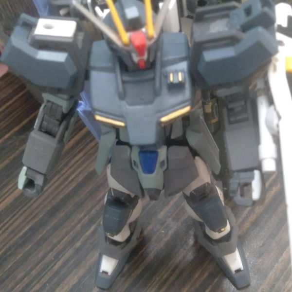 This is one of my Strike custom builds. It's meant to be a special ops Strike. A machine used on special missions that is able to get in under the radar and destroy any and all enemy mobile suits. I'm not quite done with the paint job. The backpack is from barbatos lupus rex that's been modified. The anti ship sword is from the perfect strike freedom and the agni is from the perfect strike. I have also added 2 beam saber handles to the shield. I transplanted the freedom knees to the strike legs using putty. Plastic plate was used to keep the backpack from moving around haha. I still need to find a beam rifle for it though. Let me know what you think of it!!（3枚目）