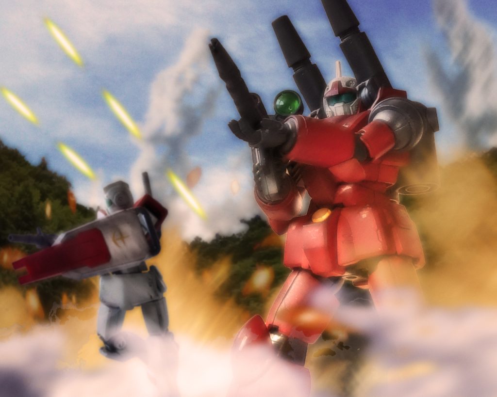 ミハル、俺はもう悲しまないぜ。お前みたいな娘を増やさせないために、ジオンを叩く!徹底的にな!決意を胸にカイは地下搬入口の敵を一掃し外に出ると、そこは砲弾と炎、煙が混ざり合う地獄だった。付近には小さな防衛線達が守ったジムがゲートを死守しようと奮戦する。