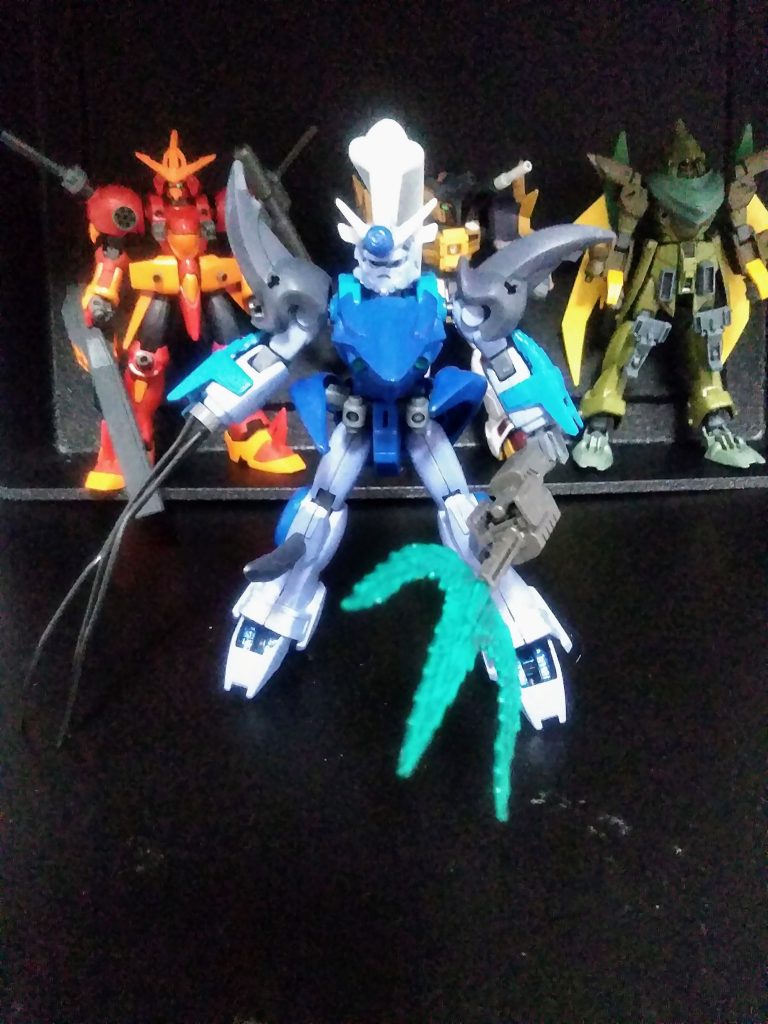 「次なるは《邪王狂乱死さ…ぐむむっ…》その弐『水妖将 ガンダム クラーケン』ふふん、コヤツは残忍だぞぅ、注意するんだな。」 …げほん!