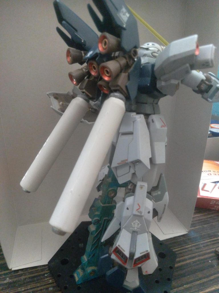 Metallic red gundam marker was used to color in the thrusters and the leg vents. I also added 2 thrusters to the shoulder armor 