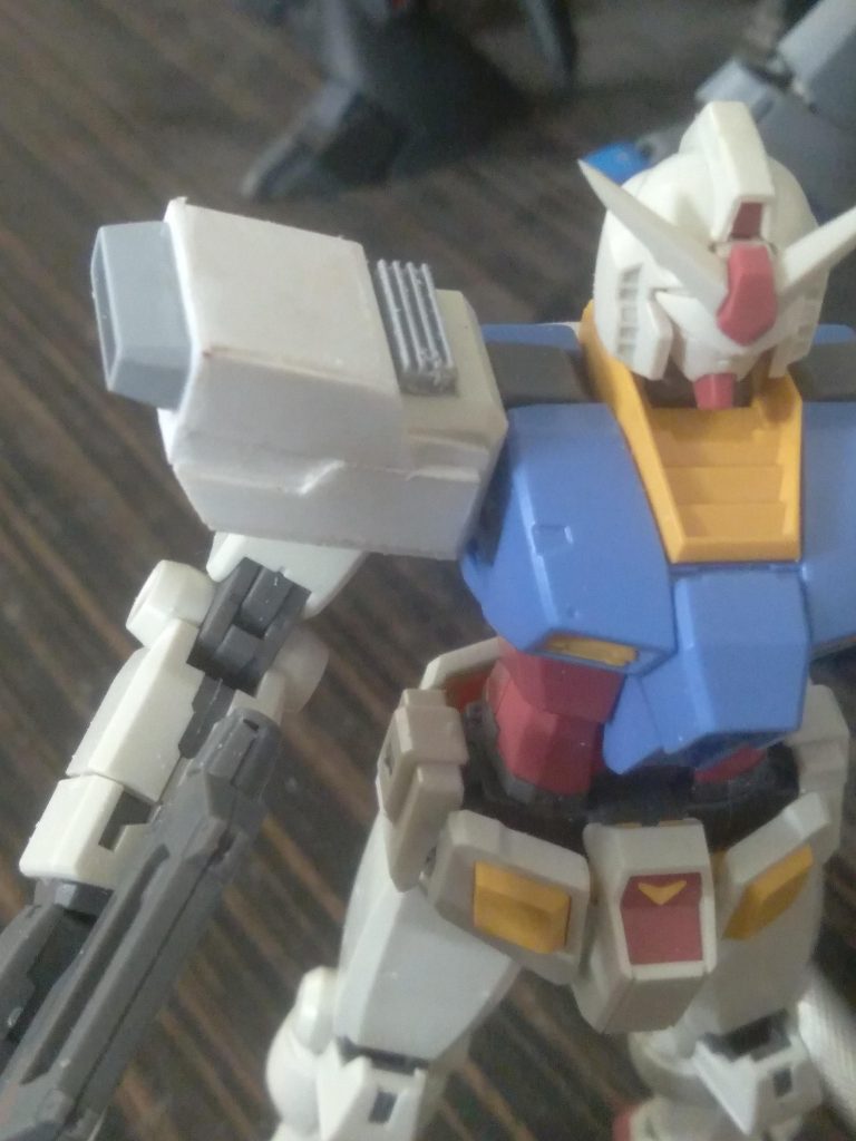 Using bandai's builders parts thrusters I added some detail overall to improve the shoulder armor 