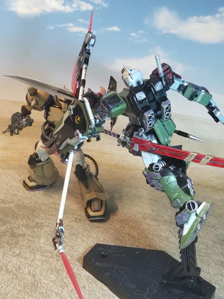 プロトタイプグフ(機動実証機)vsジム・ストライカー「………」ガッ❗「そんなデカい得物をよく振り回せる!」