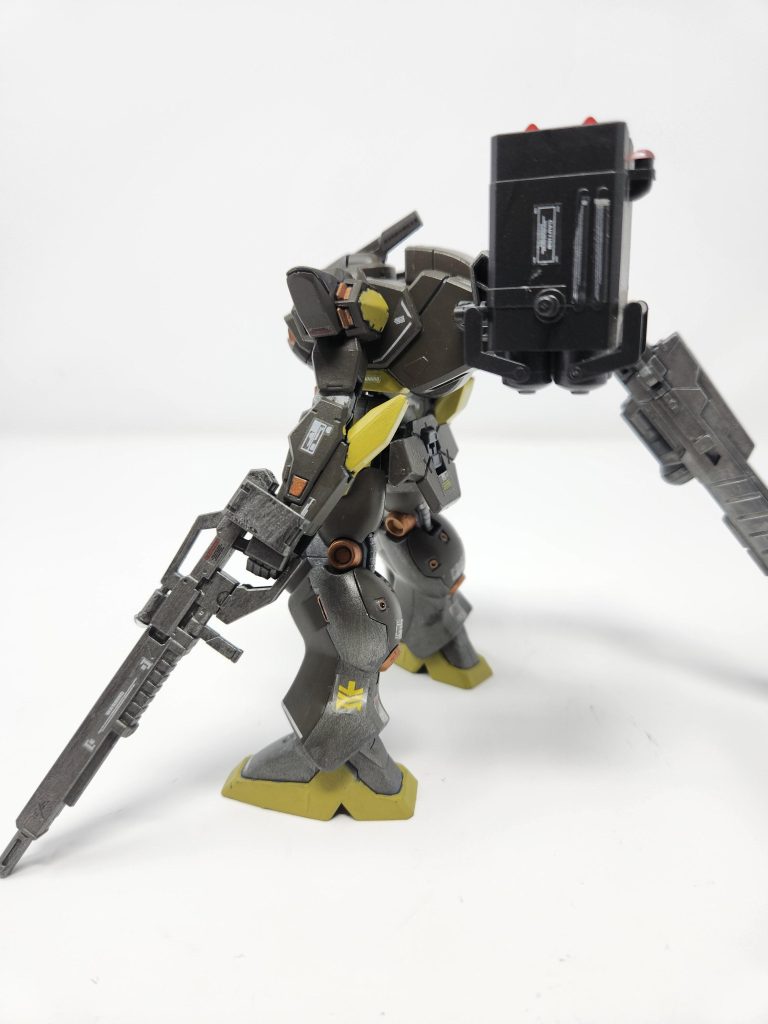 The left arm holds a Heavy Long Range Rifle for persicion damage for far distance id the enemy takes long range.