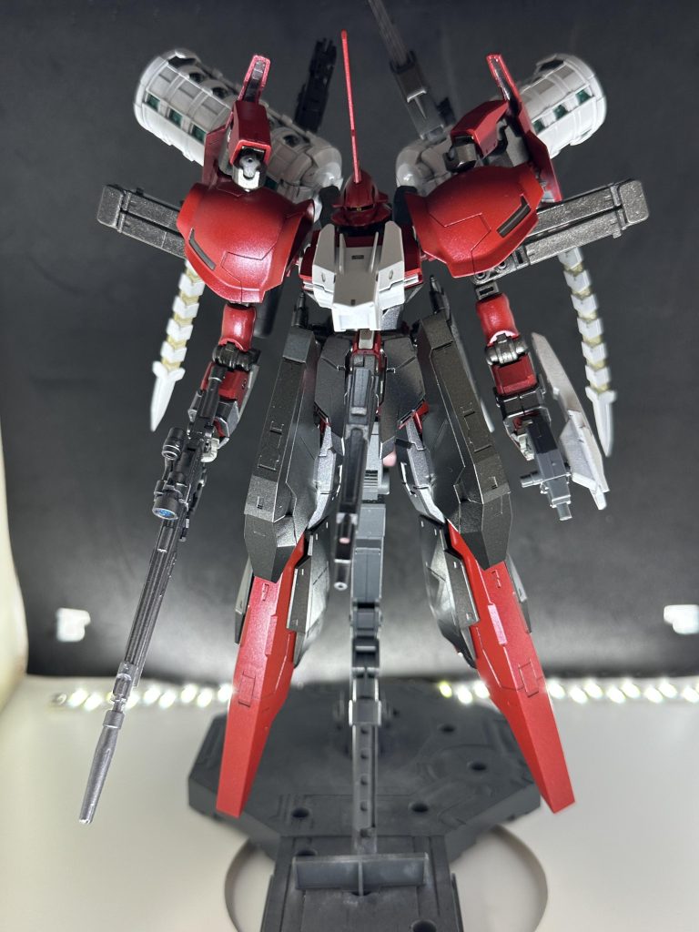 『YMF-X0001√O ネメシス=レフコス』『ZGMF-X0002√A アナテマ=プテリュクス』の兄弟機として開発されたサードステージに位置する新型MSである。本機は3番目に開発された機体であり、3機の中で最も安定した性能を持つことから型式番号に√ は外され、開発中では、√Oの先にあるガンダム(と一部で呼ばれる機体)の意味で『after G√O (アフターグロー)』と呼ばれていた。