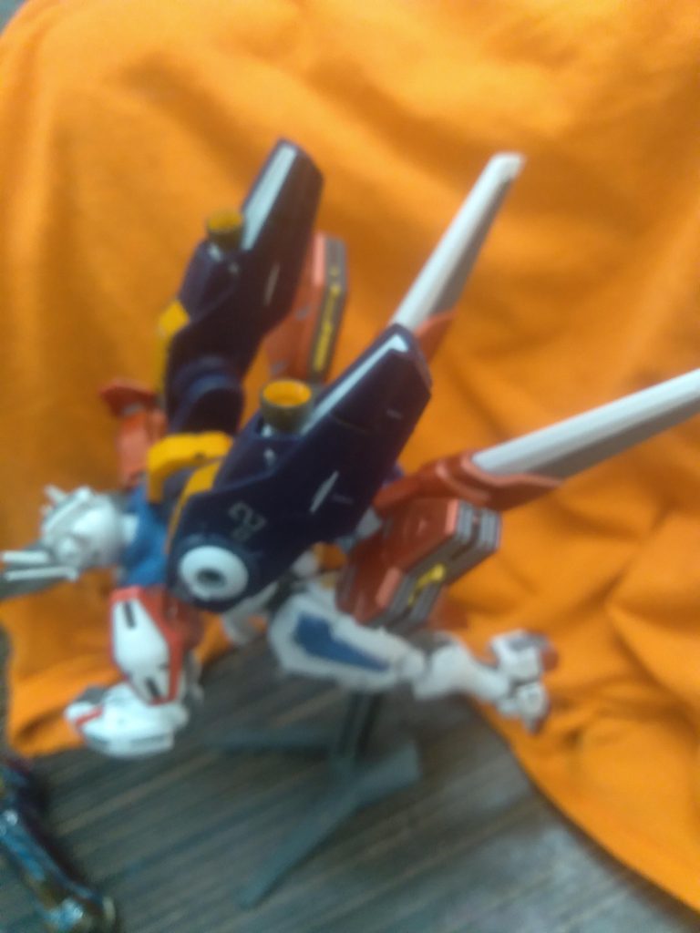 Aerial Rebuild has the mirasoul flight unit along with the Rebuild backpack attached on the waist of the Gundam