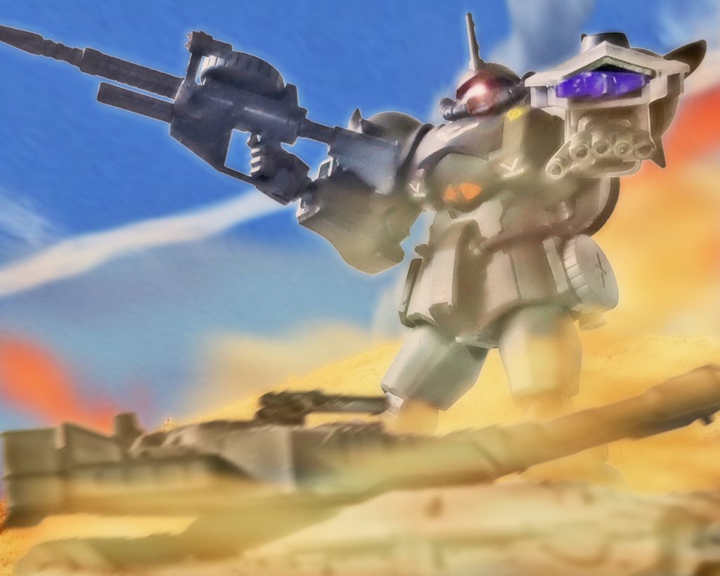 「死の砂嵐か‥」戦車中隊の指揮官は後方の見渡せる位置からこの光景を目にすると唾を飲んだ。グフは満足に動けない61式を容赦無く潰していく。この機動力の前に61式も火力が活かせず放った弾は虚しく空を切る。「うわぁぁっ‥!」業火を背にグフは自分より小さな戦車を見下ろすとハッチから頭を出した戦車兵と目が合う。蛇に睨まれた蛙とはよく言ったものでこれには戦車も一瞬動きを止める。だが戦場でこれはご法度だ。怯えた奴から消える。数で有利だった連邦軍の戦車隊は僅か数分で10両を失う事態となった。