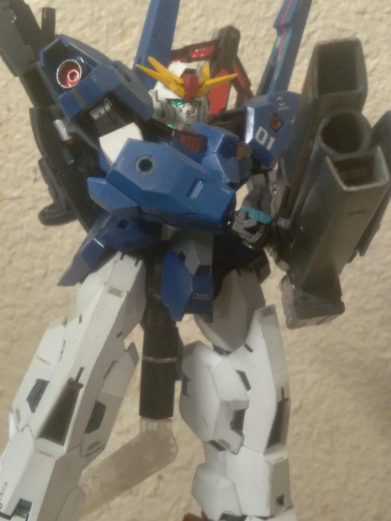 First is a custom mega beam launcher I made using the gatling gun that came with the kit. I also used some junk parts and a piece of plastic tubing to make it unique. I tried to make a type of turbine on each side similar to the gn bazooka of virtue