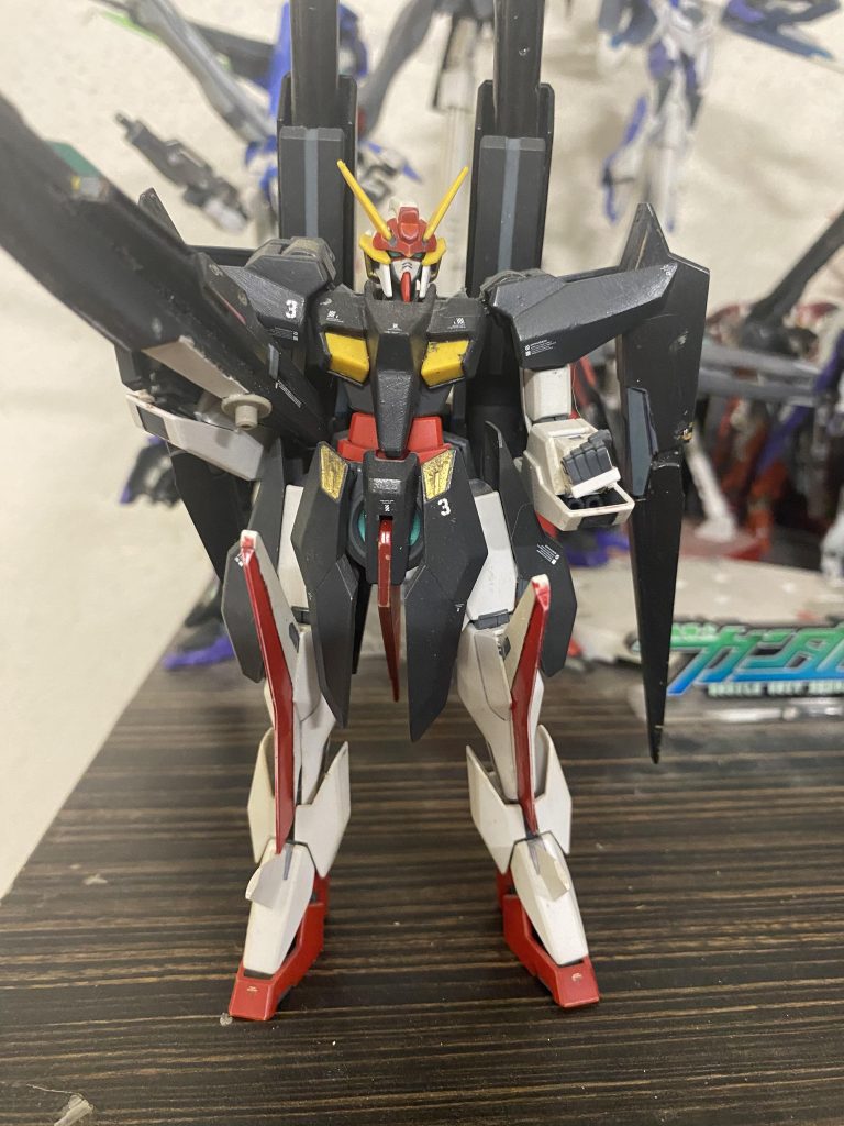 GN-R3 Gundam Cygnus Transformable support unit. It has a high speed Cruiser mode that it can change into. It's armaments are: gn arm vulcans, gn cannon/missile pods, gn cannon