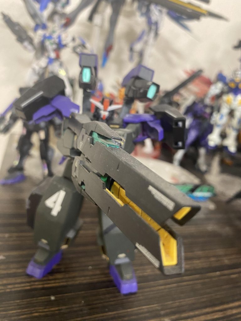 GN-R4 Gundam Oberon The bombardment/heavy weapons unit of the group. Oberon has 4 gn field emitters on the legs and shoulders. The main weapon is the gn launcher II. 2 more gn cannons are mounted on the back near the gn drive. They also have thrusters built it to assist in movement