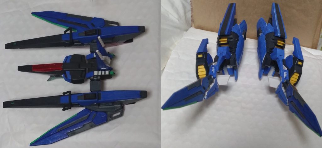 前の写真で出た青の装備について説明します。左は『イクシードファイター』、本機と着脱可能とされる遠隔操作できる支援無人戦闘機。本機から分離し、支援機としてコンビネーション攻撃が可能。右の写真は『イクシードレッグアーマー』と呼ばれるモノで、ある形態に必要不可欠なアーマー。このアーマーも遠隔操作でき、イクシードファイターに装着されている『GNソードライフル』を装着することができる。装着した状態、クローや射撃で敵機を攻撃する。イクシードファイターが本機と合体している間、特に普段は本機の傍を浮遊しており、ファンネルみたいな役割を持つ。