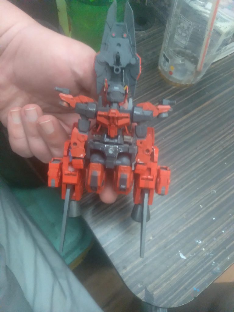 From the bottom view. It doesn't look like a mobile suit laying down, lol.