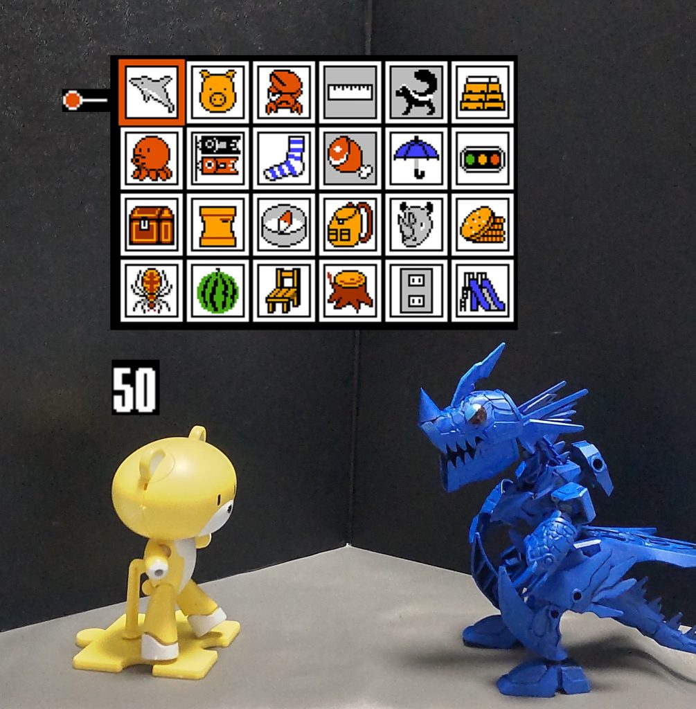 ♪BGM：「決戦！ビッグプロトワギャン」「しりとりで勝負だ！俺から行くぞ！」○ルールについて縦横合計２４マスあるイラスト達の名前でしりとりを行い、時間内にクリア規定ポイント数答えるか、相手を詰まらせたら（答えられるイラストがない）勝ちとなる。※但し、ラスボスであるビッグプロトワギャン戦で規定ポイントを越えずに詰まらせて勝とうとしても、「こんな少ないポイントでは認めることはできん！」と言って最初からやり直しとなる。※尚、イラスト達は答えるごとにどんどん入れ替わっていく仕様になっています。おこさまコースでは、上記の画像のイラスト達だけで簡単なのだが、ひとなみコース以降はガンダムに関するものまで混ざってくる。かみさまコースにもなると、制限時間が短い上に明らかに答えてはいけないものまで平気で混ざってくるので要注意。（例：ギャン等「ン」で終わるもの）おこさま（規定ポイント：24（36））ひとなみ（規定ポイント：48（60））かみさま（規定ポイント：80（96））※（）内の数字はパーフェクト数値です。