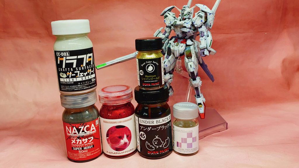 メカサフスーパーヘビィを下地に白→クラフタサーフェイサー赤→パールプレミアムブリリアントレッド金→ボーンペイント アンダーブラック2→マキシマムシャインゴールドシェルユニット→メタリックプリズムホログラムシェルユニット周辺にも吹き付けてます。写真撮り忘れましたが関節→HJVパープルグレースミ入れはMr.ウェザリングカラーフィルタリキッドのレイヤーバイオレットです。