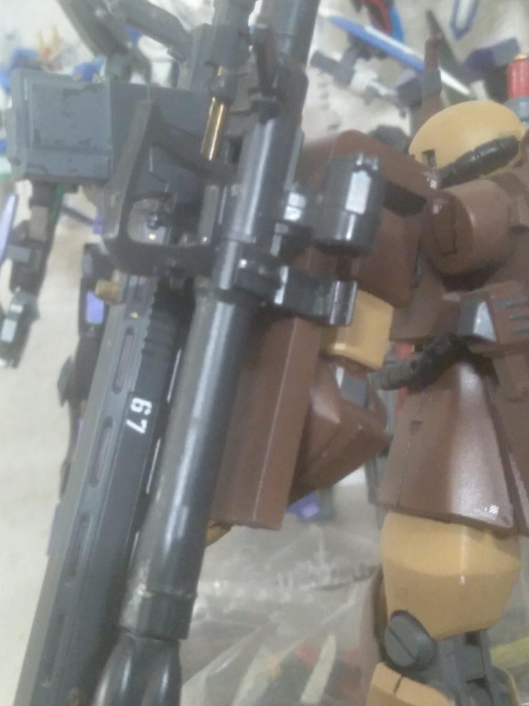 Using the zaku shield weapon holder, I was able to attach the anti-ship rifle to it as well.