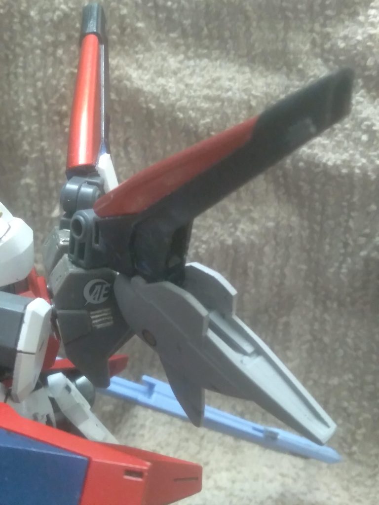 That is all for the setting. I will discuss how I was able to install the V2 parts. I removed the ball socket that they were originally used to connect to the V2 assault buster. I then glued in parts from the powered arms set. For strength, plastic plate was added to reinforce the new connection system. The sword is from the perfect strike freedom. I modified it so it can be mounted on the back skirt when not in use 