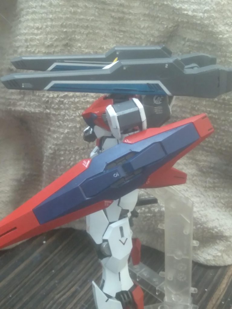 Side view of the cannons deployed. They are from the hgce freedom. I added a different part on the back so they can be mounted this way. I also added thrusters on the back for vents for discharging heat