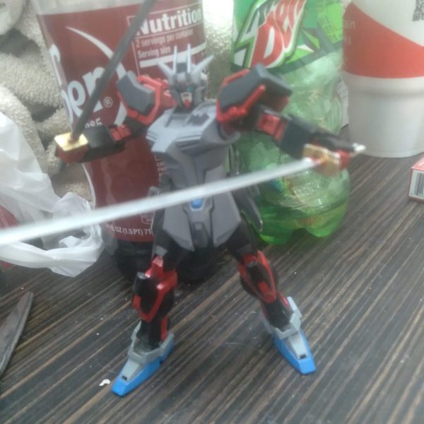 I forgot I started this project. I had an idea of making a red frame Strike custom. The torso has some work done to it. Mainly plastic plate. I also added chest vents and a sensor. The swords are from the sengoku astray. I glued some of the #11 poly caps on the side skirts. They work perfectly to hold the swords. I'm not quite finished painting it, lol. A few minutes ago, I took a spare core splendor from the hgce Impulse and drilled a hole so the aile striker pack can be delivered during battle. I have to figure out a way to mount the shield and rifle somehow. （1枚目）