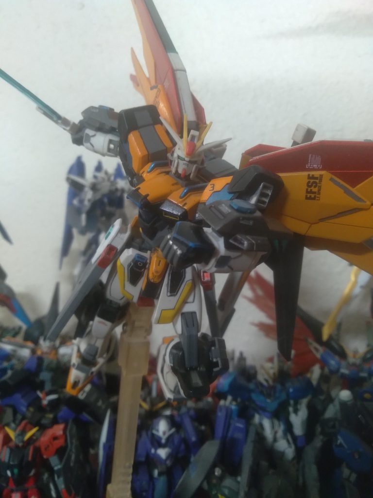 The main changes were colors, head swap, and side skirt changes. The head is from the force Impulse and the side skirts are from freedom. I used mostly Tamiya brand paints. The colors were orange, black, yellow, and metallic blue. I used Vallejo neutral gray for the detail painting